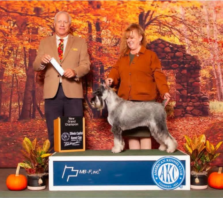 Amy and Ms. Myrtle with a New Grand Champion award